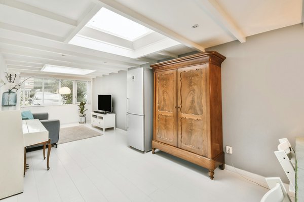 What are the key considerations for installing a skylight in a UK coastal area prone to heavy rains?