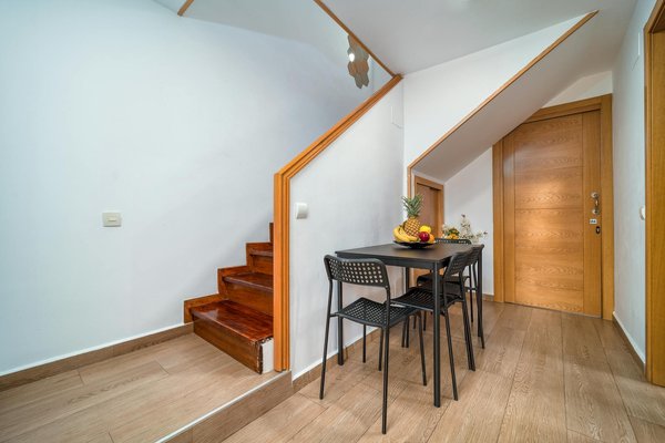 How can you effectively utilize under-stair spaces in a UK terraced home for additional storage?