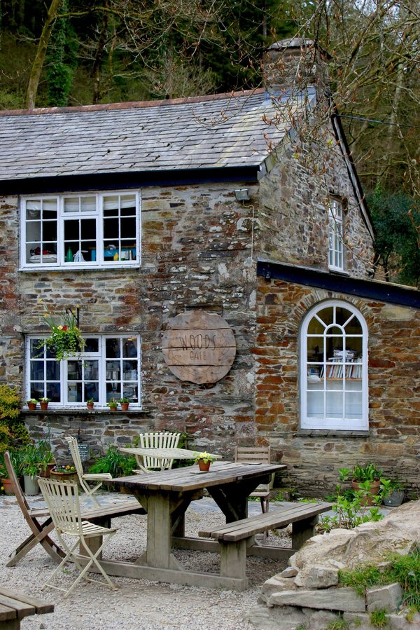How can you minimize heat loss through windows in a UK stone-built cottage?